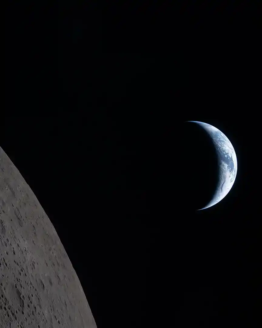 Photo: Earth behind the Moon from Artemis II · Earth